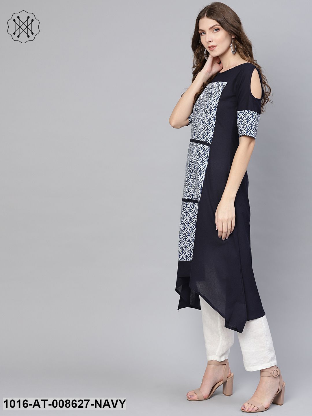 Solid Navy Blue Asymetric A-Line Kurti With Navy Blue Floral Printed Patches On The Yoke With A Boat Neck And Elbow Sleeves